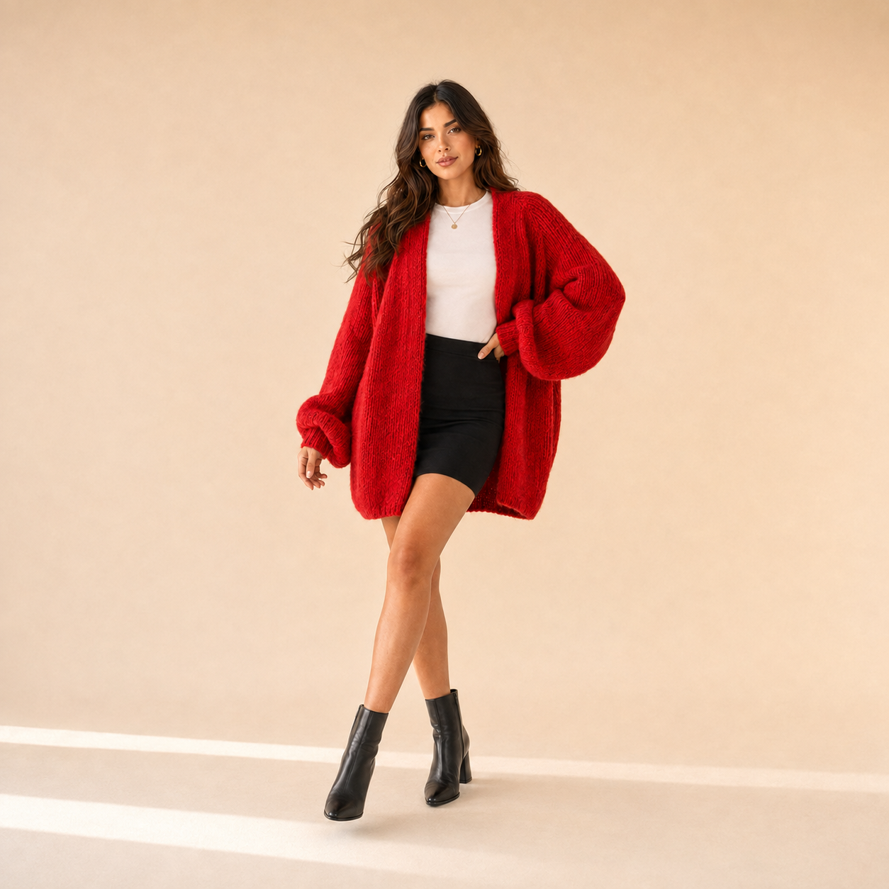 Woman modeling The Sienne Cloud Cardigan in Bright Red