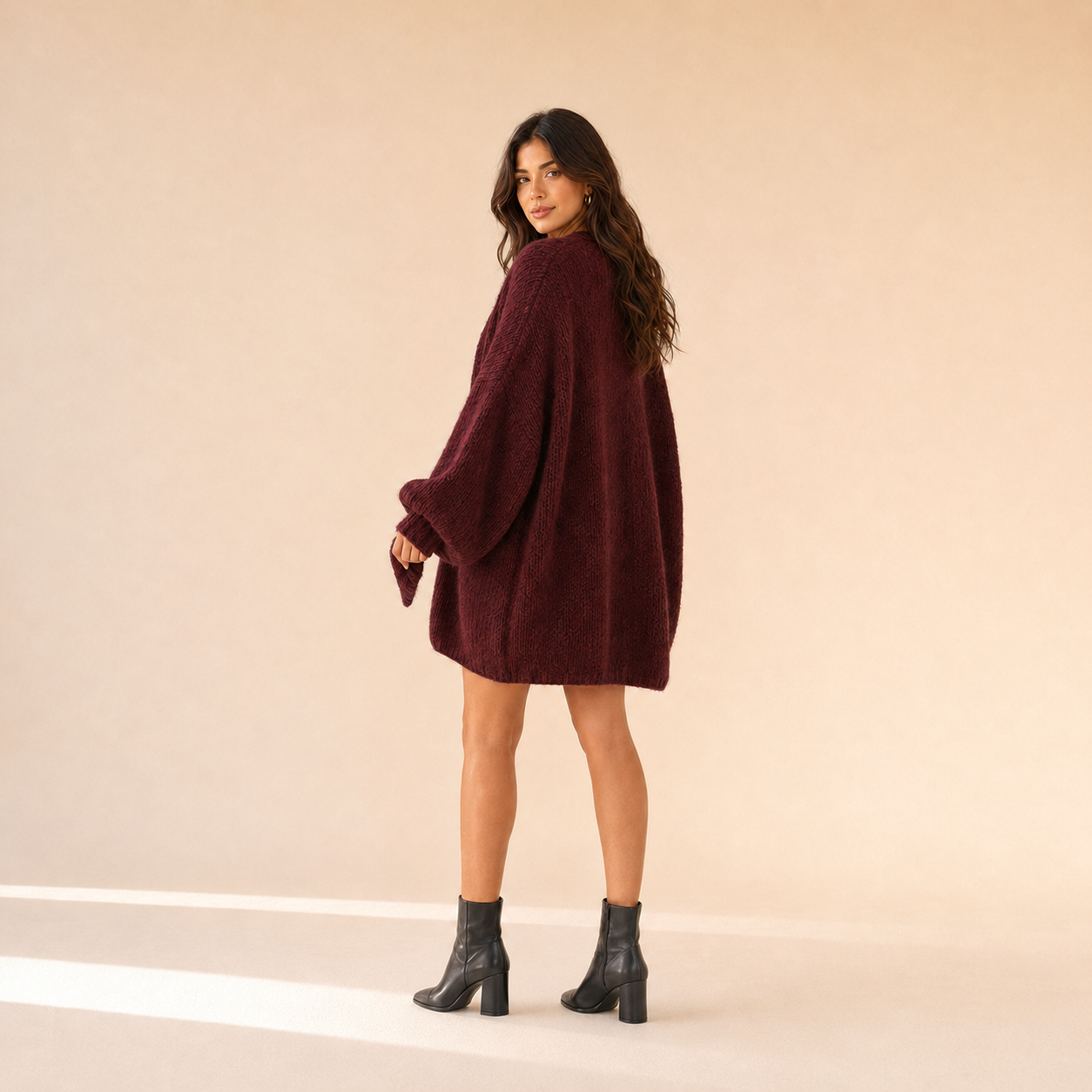 Woman modeling The Sienne Cloud Cardigan in Burgundy