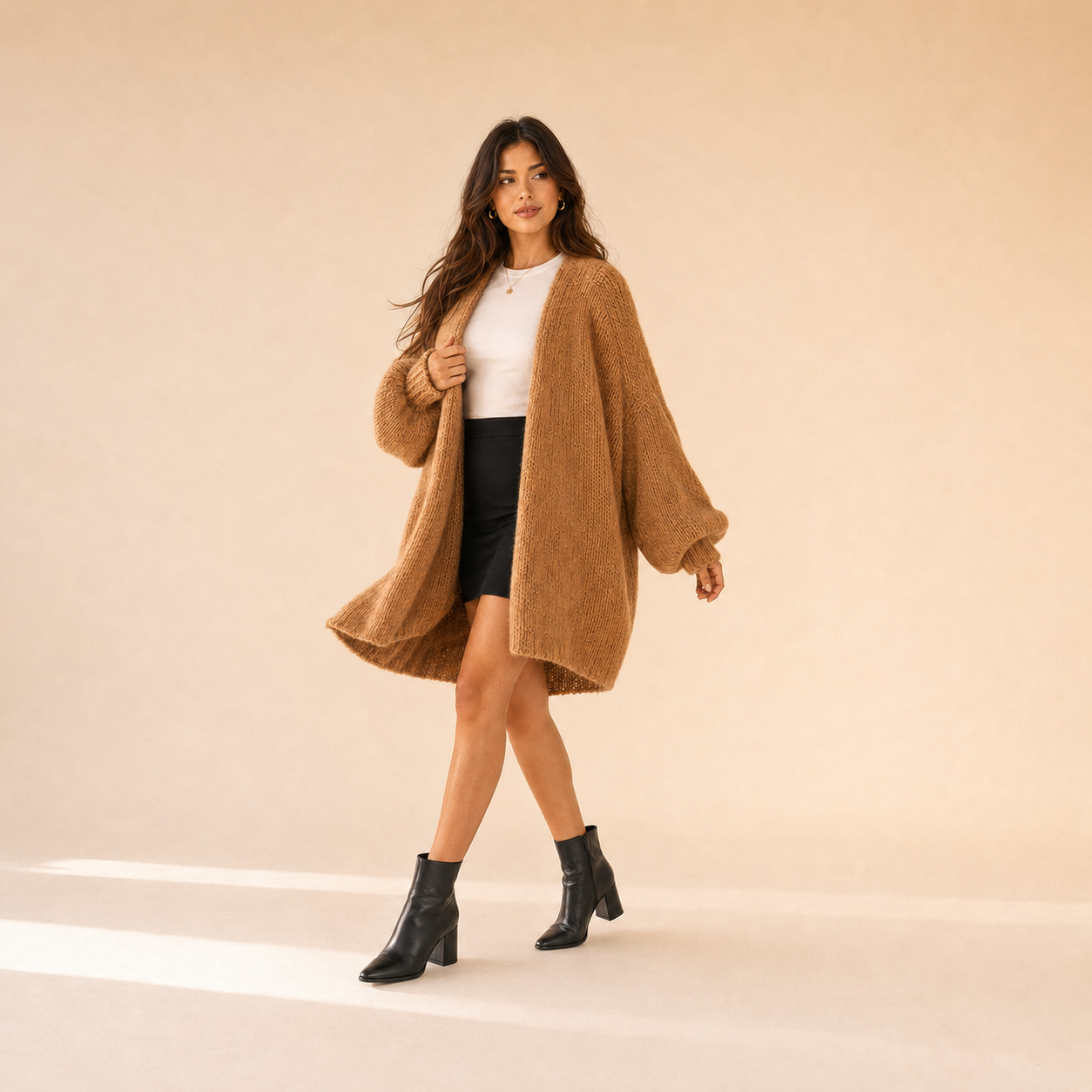 Woman modeling The Sienne Cloud Cardigan in Camel