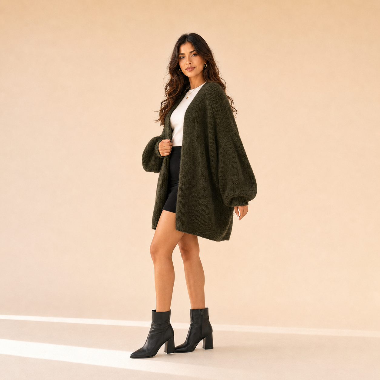 Woman modeling The Sienne Cloud Cardigan in Dark Olive